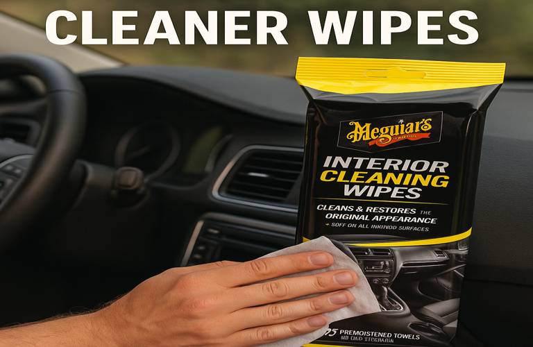 A person using the best meguiars interior cleaner for cars , wiping a dashboard with Meguiar's cleaning wipes for a spotless, refreshed look.