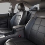 High-quality coverado car seat covers fitted on front and rear seats of a sleek modern car, showcasing luxury, comfort, and durable leather finish.