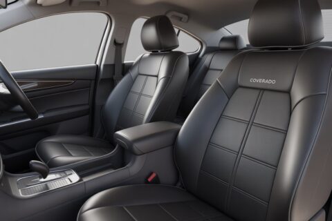 High-quality coverado car seat covers fitted on front and rear seats of a sleek modern car, showcasing luxury, comfort, and durable leather finish.