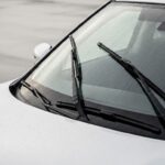 Best Wiper Blades for Nissan Rogue: Size, Buying Guide & Top Picks – close-up of windshield wipers clearing rainwater on a Nissan Rogue, showing clean glass and improved visibility during wet conditions