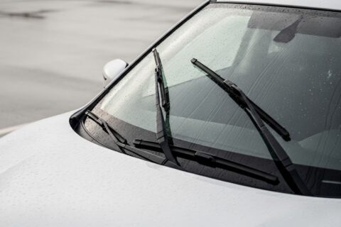 Best Wiper Blades for Nissan Rogue: Size, Buying Guide & Top Picks – close-up of windshield wipers clearing rainwater on a Nissan Rogue, showing clean glass and improved visibility during wet conditions